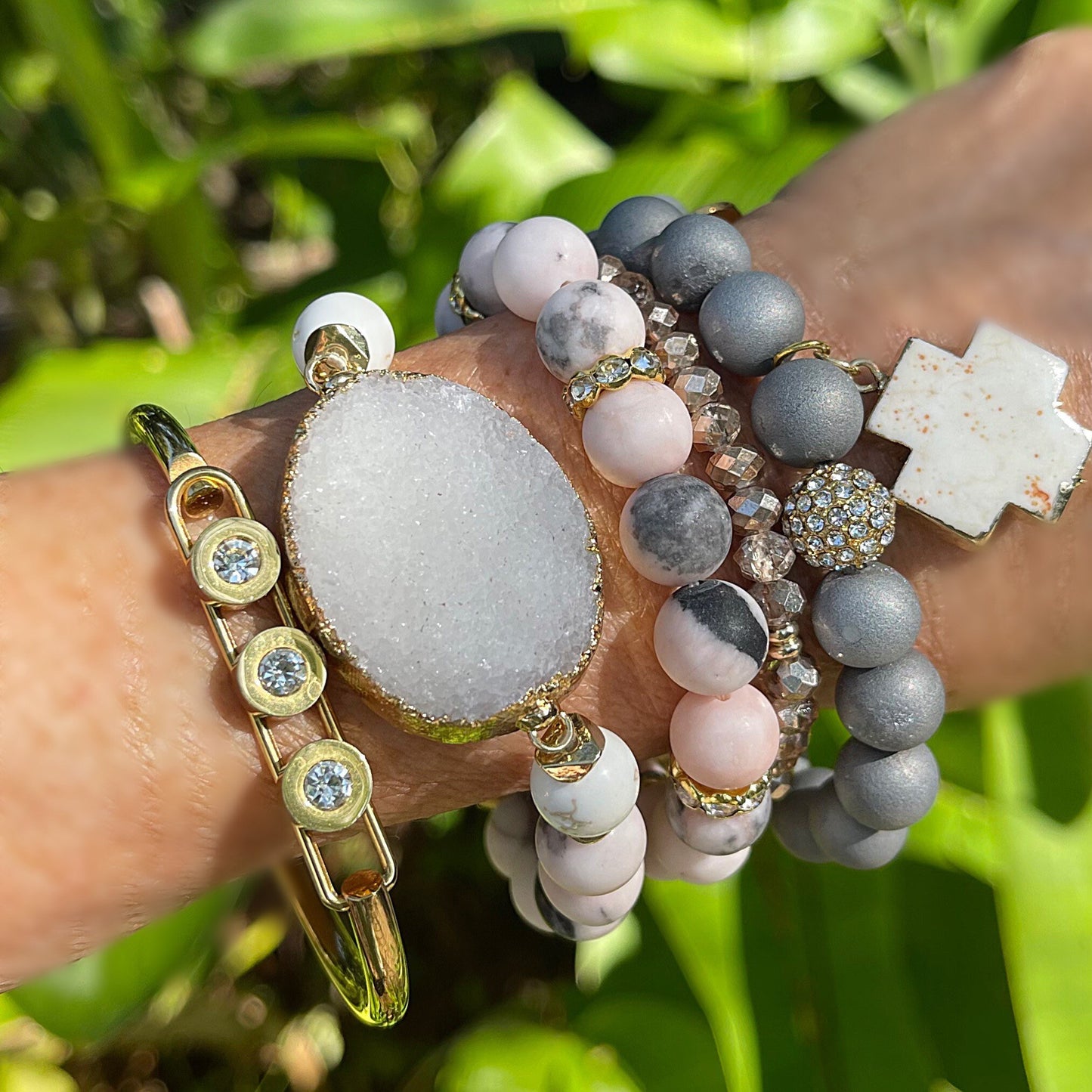 Pink Zebra Jasper beads with a druzy quartz as center stone. Matching beaded bracelet and a geode bracelet with cross charm/gold cuff