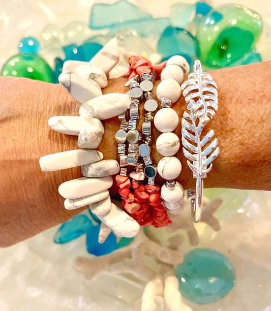 Howlite and coral multi strand bracelets accented with silver olive leaf cuff. Simple and a showstopper