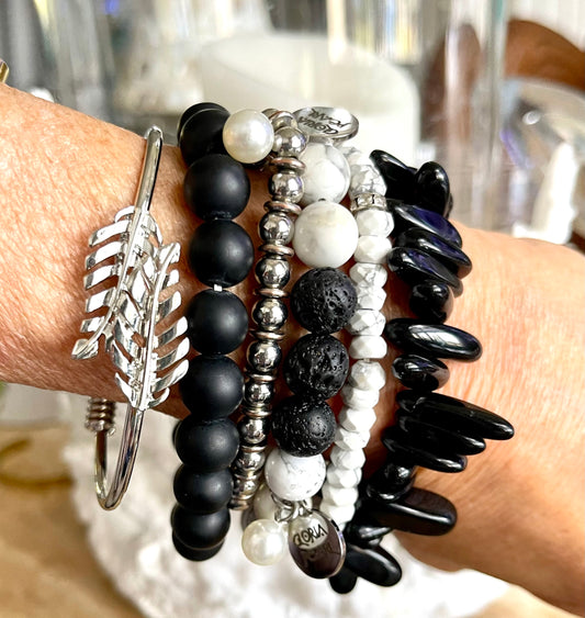 Black onyx beads/lava and Howlite beads/silver leaf cuff and silver bead bracelet