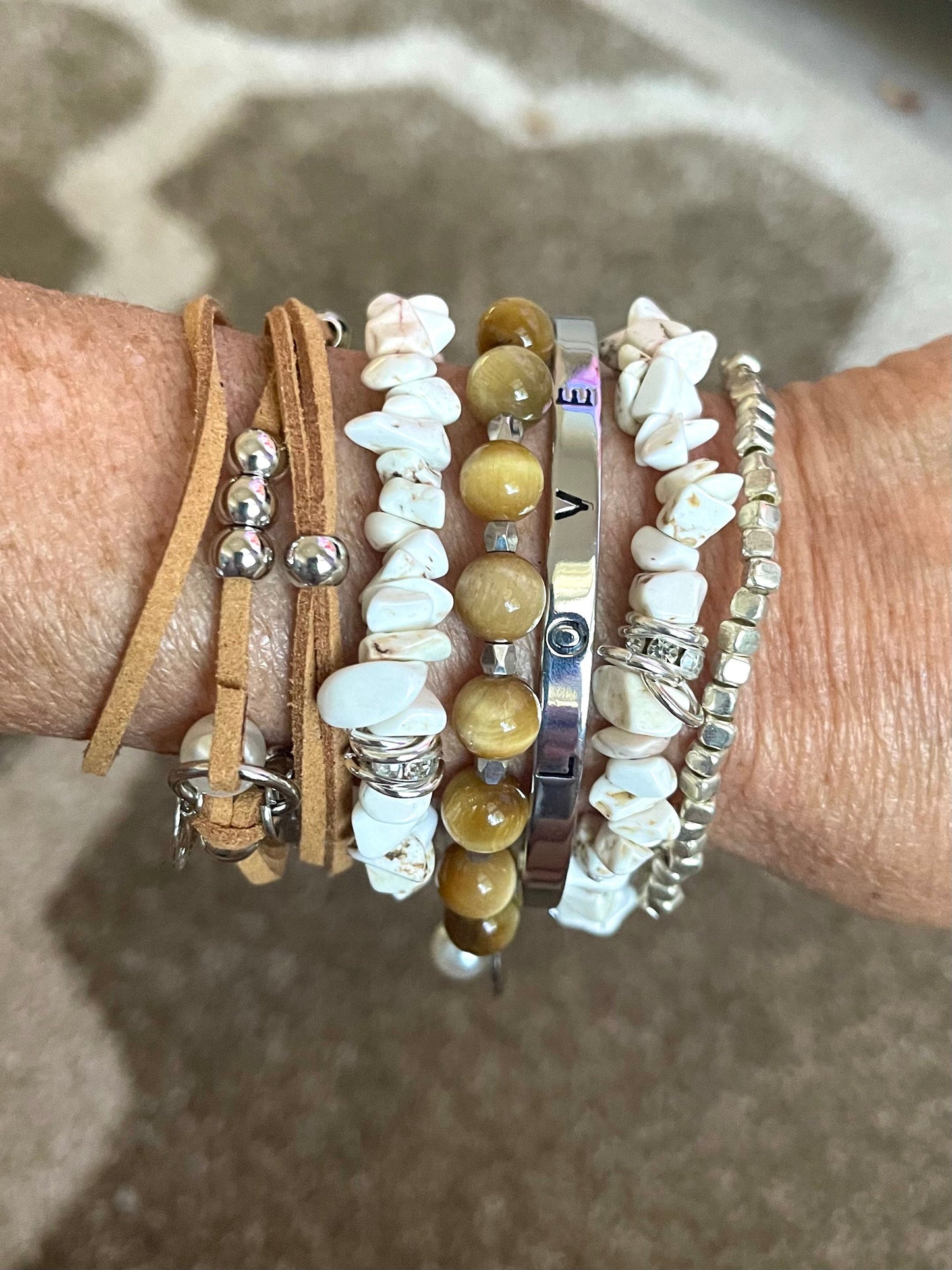 Tiger stone beads with two howlite bracelets accented with silver and leather wrap bracelet